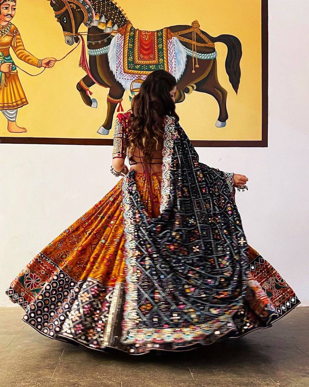 Orange Mirror Work Megic Navratri Lehenga Choli.