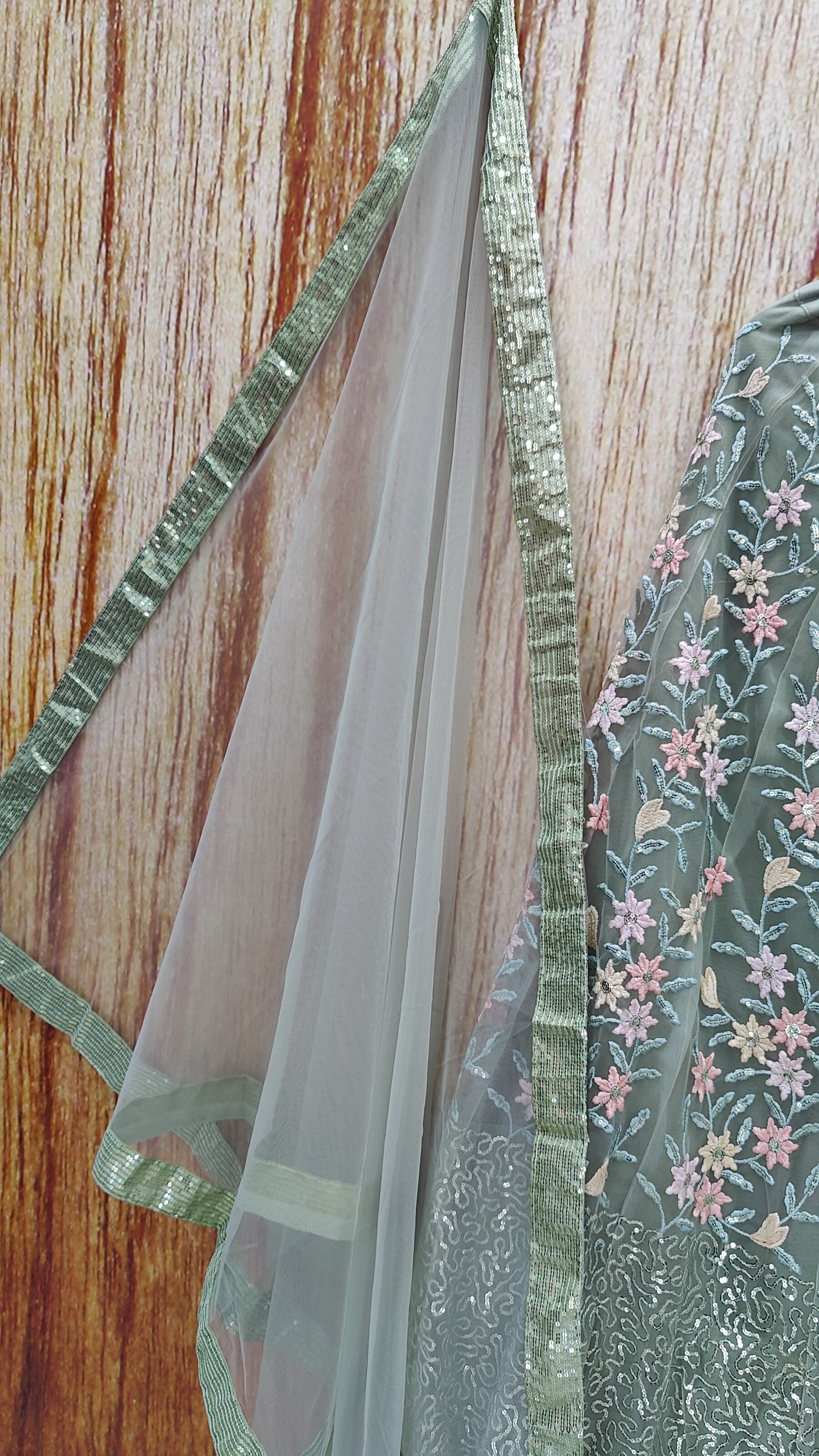 Pista Color Designer Sequins Embroidery Work Net Lehenga Choli