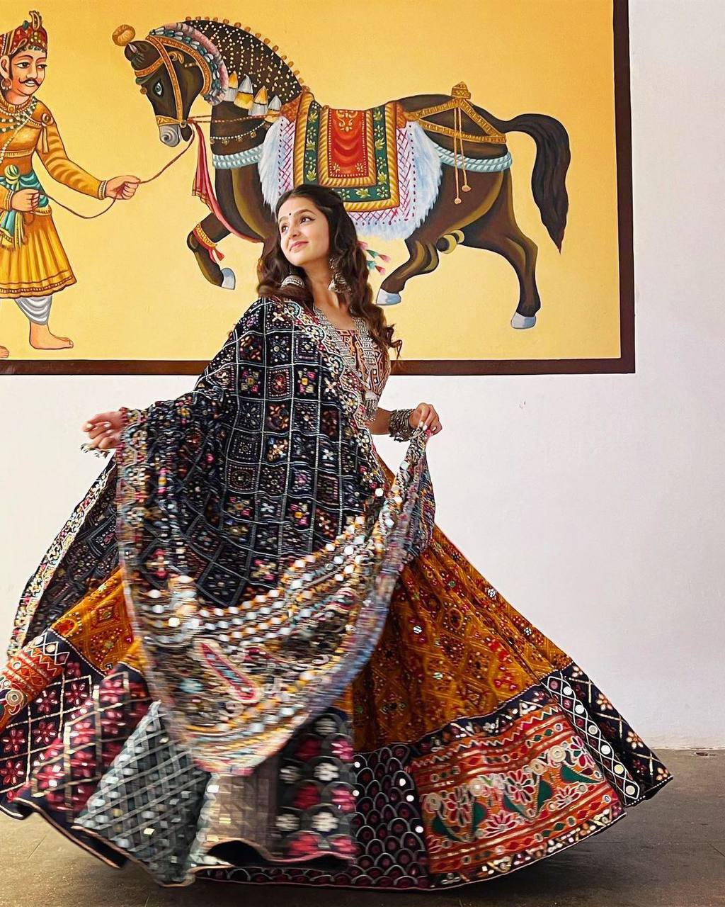 Orange Mirror Work Megic Navratri Lehenga Choli.