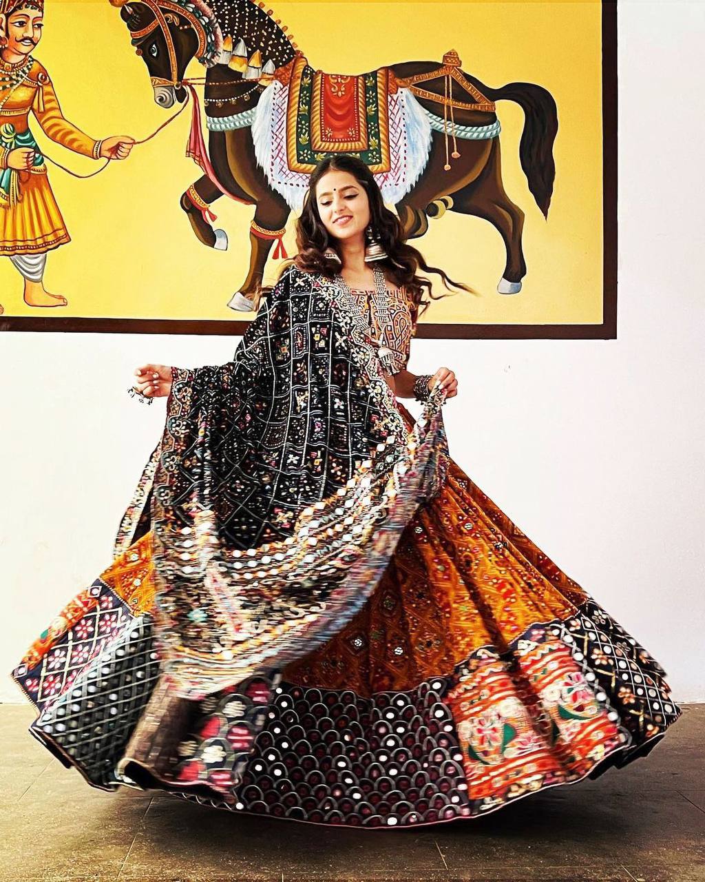 Orange Mirror Work Megic Navratri Lehenga Choli.