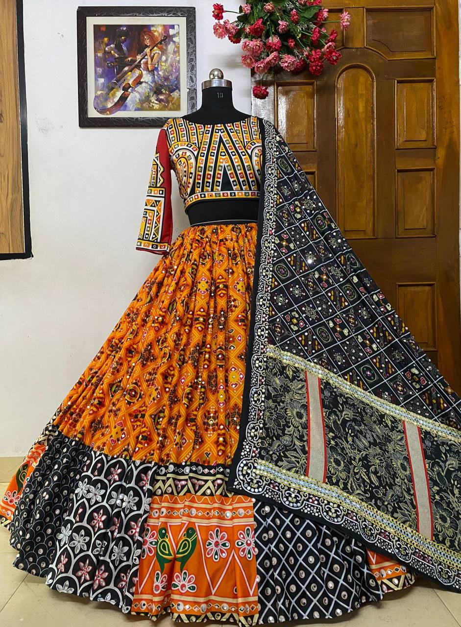 Orange Mirror Work Megic Navratri Lehenga Choli.
